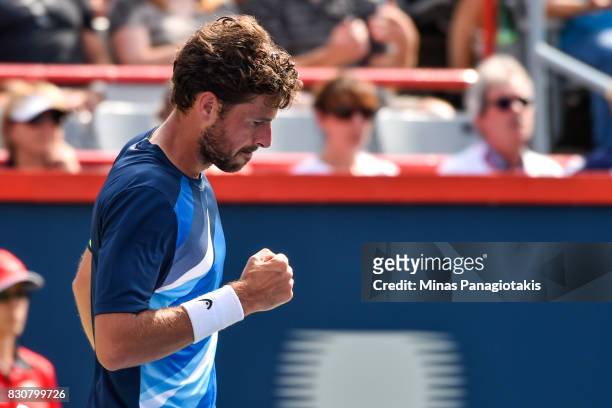 Robin Haase of Netherlands reacts after scoring a point against Roger Federer of Switzerland during day nine of the Rogers Cup presented by National...