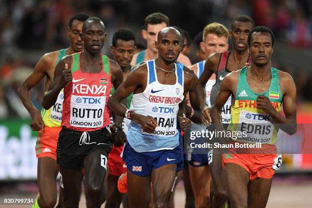 Cyrus Rutto of Kenya, Mohamed Farah of Great Britain and Muktar Edris of Ethiopia compete in the Men's 5000 Metres final during day nine of the 16th...