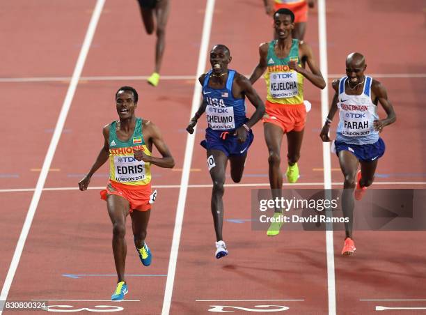 Muktar Edris of Ethiopia, Mohamed Farah of Great Britain and Paul Kipkemoi Chelimo of the United States cross the finishline in the Men's 5000 Metres...