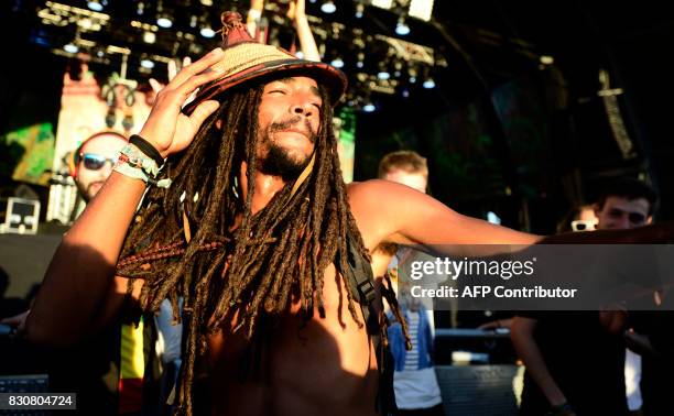 Participant dances during the Rototom Sunsplash European Reggae Festival in Benicassim, Castellon province, on August 12, 2017. The Rototom Sunsplash...