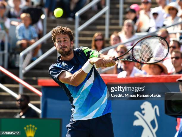 Robin Haase of Netherlands prepares to hit a return against Roger Federer of Switzerland during day nine of the Rogers Cup presented by National Bank...
