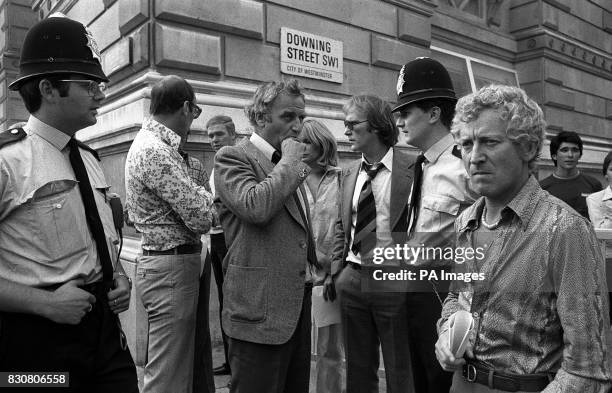 Policemen stand with the top cops from "Van Der Valk' and 'The Sweeney' outside 10 Downing Street while they presented a petition protesting over...