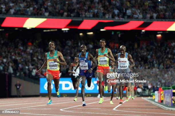 Muktar Edris of Ethiopia, Mohamed Farah of Great Britain and Paul Kipkemoi Chelimo of the United States cross the finishline in the Men's 5000 Metres...