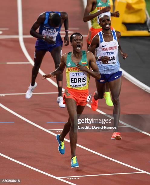 Muktar Edris of Ethiopia celebrates as he crosses the finishline ahead of Mohamed Farah of Great Britain, and Paul Kipkemoi Chelimo of the United...