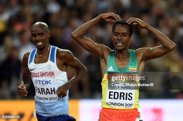 Muktar Edris of Ethiopia does the "Mobot" as Mohamed Farah of Great Britain looks on after crossing the finishline in the Men's 5000 Metres final...