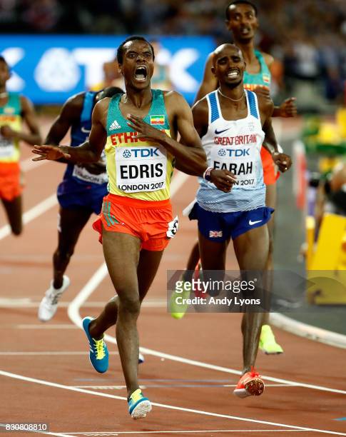 Muktar Edris of Ethiopia celebrates as he crosses the finishline ahead of Mohamed Farah of Great Britain, and Paul Kipkemoi Chelimo of the United...