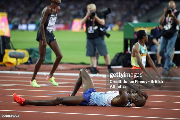 Muktar Edris of Ethiopia and Mohamed Farah of Great Britain react after crossing the finishline in the Men's 5000 Metres final during day nine of the...
