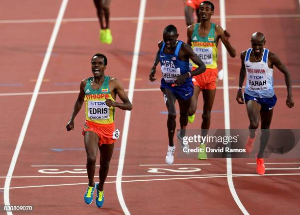 Muktar Edris of Ethiopia celebrates as he crosses the finish line ahead of Mohamed Farah of Great Britain, Yomif Kejelcha of Ethiopia and Paul...