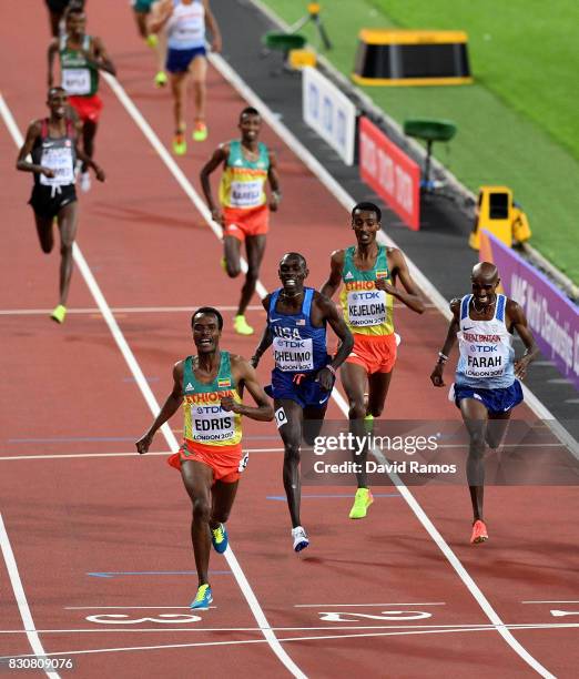 Muktar Edris of Ethiopia celebrates as he crosses the finish line ahead of Mohamed Farah of Great Britain, Yomif Kejelcha of Ethiopia and Paul...