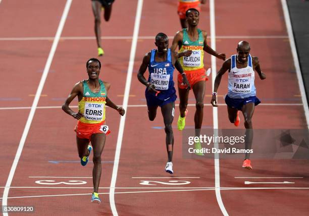 Muktar Edris of Ethiopia celebrates as he crosses the finish line ahead of Mohamed Farah of Great Britain, Yomif Kejelcha of Ethiopia and Paul...