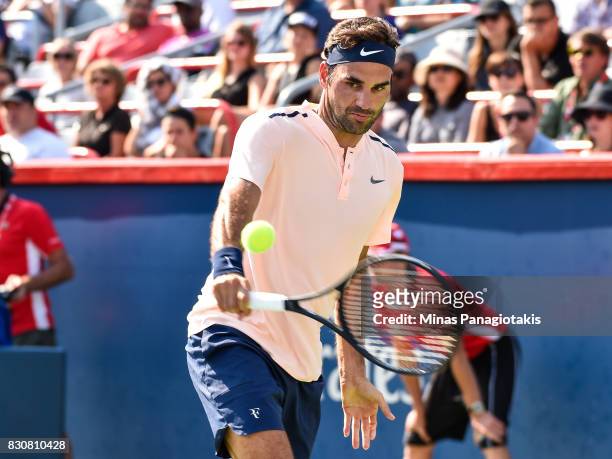 Roger Federer of Switzerland hits a return against Robin Haase of Netherlands during day nine of the Rogers Cup presented by National Bank at Uniprix...