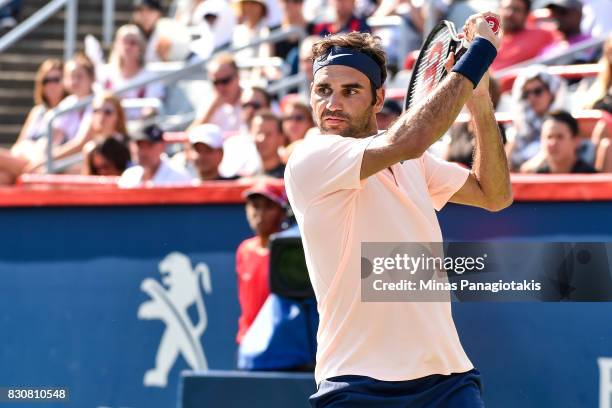 Roger Federer of Switzerland prepares to hit a return against Robin Haase of Netherlands during day nine of the Rogers Cup presented by National Bank...