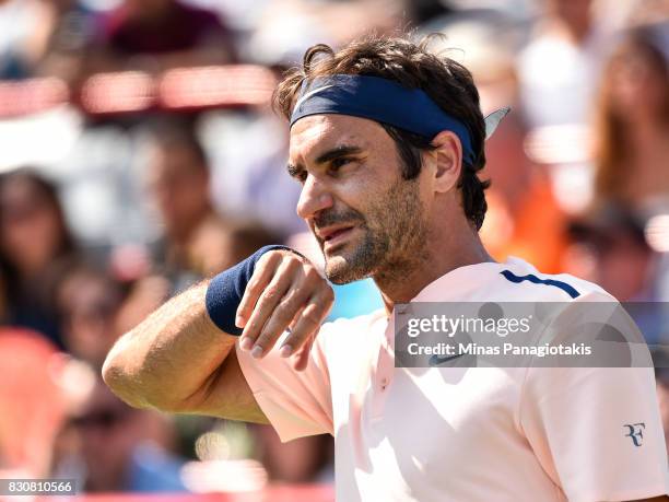 Roger Federer of Switzerland looks on against Robin Haase of Netherlands during day nine of the Rogers Cup presented by National Bank at Uniprix...