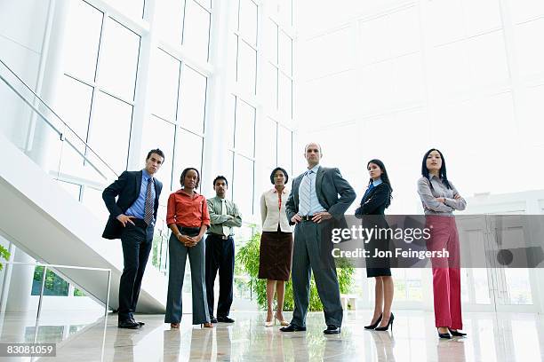 portrait of young professionals - group of businesspeople standing low angle view stock pictures, royalty-free photos & images