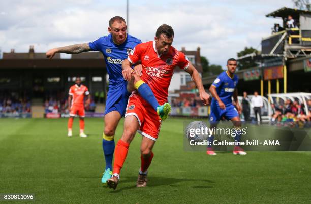 Barry Fuller of AFC Wimbledon and Shaun Whalley of Shrewsbury Town during the Sky Bet League One match between A.F.C. Wimbledon and Shrewsbury Town...