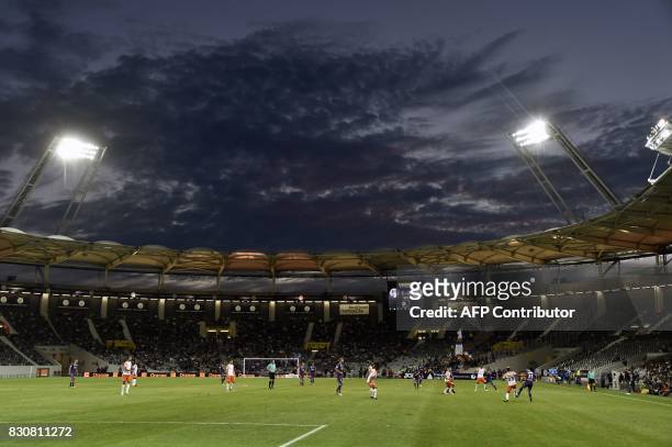 Players vie on the pitch during the French L1 football match Toulouse against Montpellier on August 12, 2017 at the Municipal Stadium in Toulouse,...