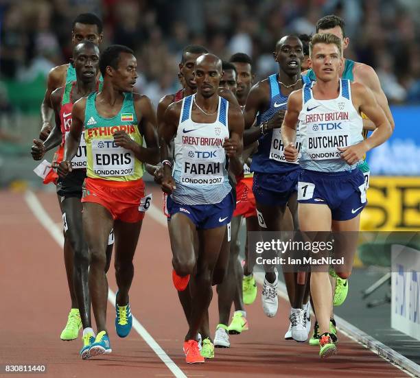 Muktar Edris of Ethiopia jostles with Mo Farah of Great Britain during the Men's 10000m final during day nine of the 16th IAAF World Athletics...