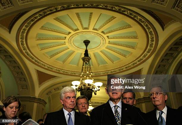 Senate Majority Leader Harry Reid speaks as Sen. Christopher Dodd , Sen. Max Baucus , Sen. Judd Gregg and Senate Minority Leader Mitch McConnell...