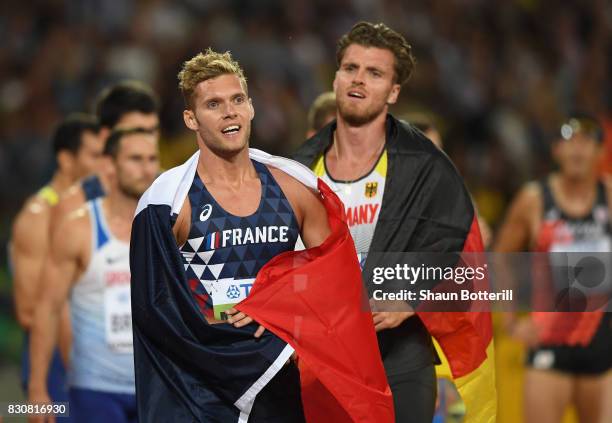 Rico Freimuth of Germany, silver, and Kevin Mayer of France, gold, celebrate after the Men's Decathlon 1500 metres during day nine of the 16th IAAF...