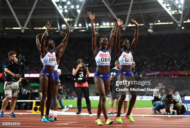 Asha Philip, Deriree Henry, Dina Asher-Smith and Daryll Neita of Great Britain celebrate winning silver in the Women's 4x100 Metres Final during day...