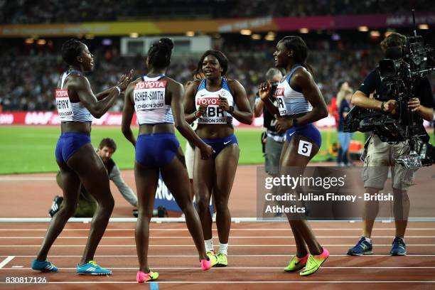 Asha Philip, Deriree Henry, Dina Asher-Smith and Daryll Neita of Great Britain celebrate winning silver in the Women's 4x100 Metres Final during day...