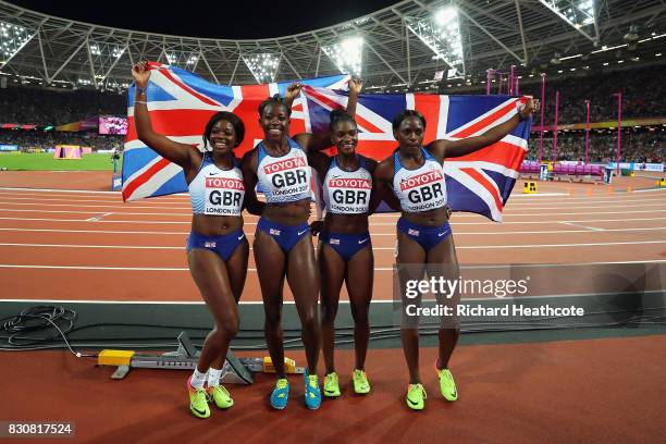 Asha Philip, Deriree Henry, Dina Asher-Smith and Daryll Neita of Great Britain celebrate winning silver in the Women's 4x100 Metres Final during day...