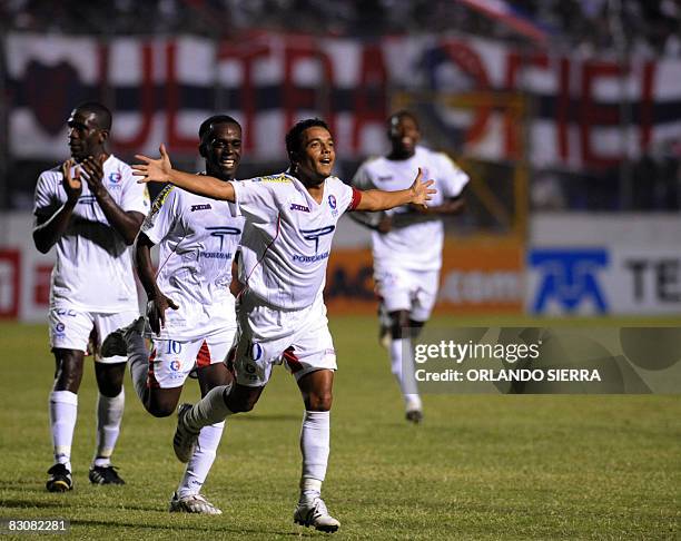 Honduran Danilo Turcios and Samir Arzu of Olimpia celebrate a goal against of Impact of Montreal, Canada, during a Concacaf Champions Cup football...