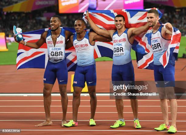 Chijindu Ujah, Adam Gemili, Daniel Talbot and Nethaneel Mitchell-Blake of Great Britain celebrate winning gold in the Men's 4x100 Relay final during...