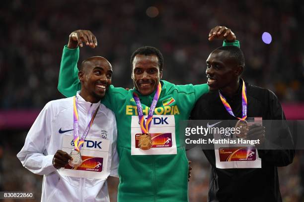 Muktar Edris of Ethiopia, gold, Mohamed Farah of Great Britain, silver and Paul Kipkemoi Chelimo of the United States, bronze pose with their medials...