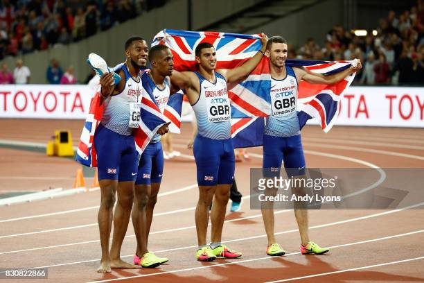 Chijindu Ujah, Adam Gemili, Daniel Talbot and Nethaneel Mitchell-Blake of Great Britain celebrate winning gold in the Men's 4x100 Relay final during...