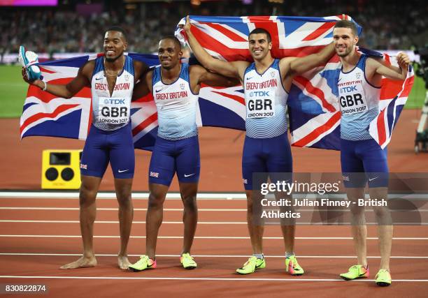 Chijindu Ujah, Adam Gemili, Daniel Talbot and Nethaneel Mitchell-Blake of Great Britain celebrate winning gold in the Men's 4x100 Relay final during...