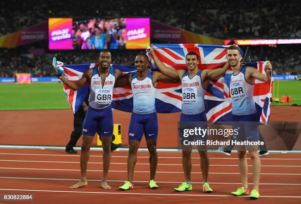 Chijindu Ujah, Adam Gemili, Daniel Talbot and Nethaneel Mitchell-Blake of Great Britain celebrate winning gold in the Men's 4x100 Relay final during...