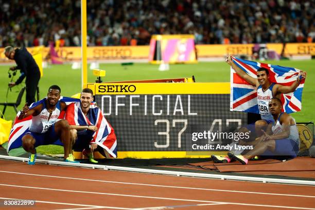 Chijindu Ujah, Adam Gemili, Daniel Talbot and Nethaneel Mitchell-Blake of Great Britain celebrate winning gold in the Men's 4x100 Relay final during...