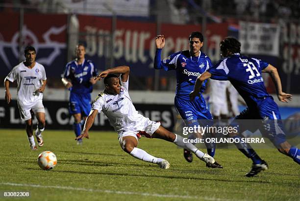 Allan Cardeck of Olimpia vies for the ball with of Montreal Impact of Canada, Tony Donatelli and Adam Braz, during a Concacaf Champions Cup football...