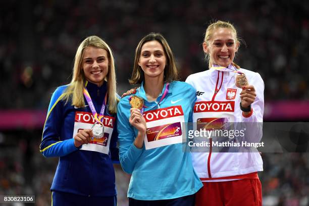 Yuliia Levchenko of Ukraine, silver, Maria Lasitskene of the Authorised Neutral Athletes, gold, and Kamila Licwinko of Poland pose with their medals...