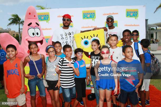 Carmelo Anthony and Jimmy Butler enjoy with kids and Nickelodeon Characters as part of Worldwide Day of Play at Bahia Urbana Bay Side Park on August...