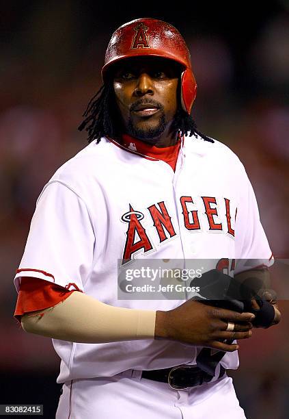 Vladimir Guerrero of the Los Angeles Angels of Anaheim walks off the field after the third out of the third inning against the Boston Red Sox during...