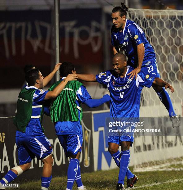 Canada's Roberto Brown and Antonio Ribeiro of Impact of Montreal celebrate a goal against Olimpia of Honduras during a Concacaf Champions Cup...