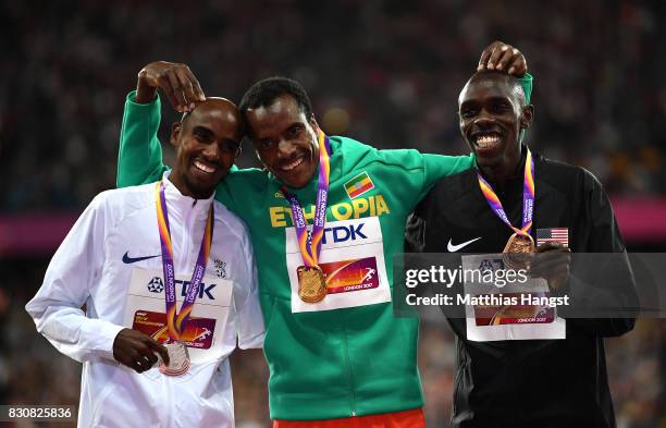 Muktar Edris of Ethiopia, gold, Mohamed Farah of Great Britain, silver and Paul Kipkemoi Chelimo of the United States, bronze pose with their medials...