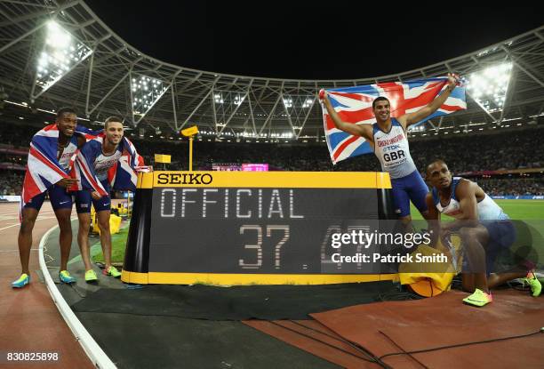 Chijindu Ujah, Adam Gemili, Daniel Talbot and Nethaneel Mitchell-Blake of Great Britain celebrate winning gold in the Men's 4x100 Relay final during...