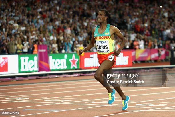 Muktar Edris of Ethiopia celebrates as he crosses the finishline in the Men's 5000 Metres final during day nine of the 16th IAAF World Athletics...