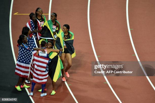The gold medal winning US relay team, US athlete Tori Bowie, Aaliyah Brown, US athlete Allyson Felix and US athlete Morolake Akinosun congratulate...