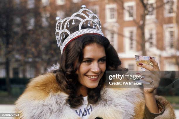 Cindy Breakspeare the new Miss World beauty-queen, raises a glass of champagne on the first day of her reign. Cindy, Miss Jamaica, won the world...