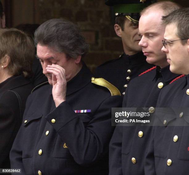 The Queen Mother's butler Billy Tallon weeps as the Queen Mother's coffin is carried by pall bearers into the Queen's Chapel at St James' palace.