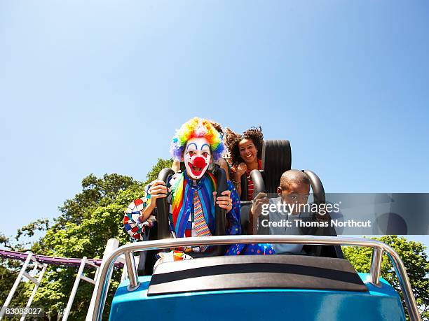clown and people on a roller coaster - man on rollercoaster stock pictures, royalty-free photos & images