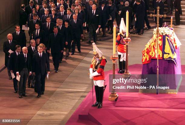 Britain's Prime Minister Tony Blair and Opposition leader Iain Duncan-Smith head the line of politicians waiting to pay their respects to Queen...