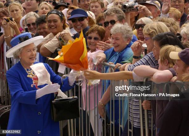 The Queen receives an enthusiastic welcome during a walkabout at the America's Cup Village, Auckland, New Zealand, as part of her Jubilee overseas...