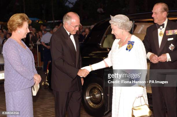 Britain's Queen Elizabeth II and the Duke of Edinburgh, right, are greeted by Australian Prime Minister John Howard and his wife Janette, left, for a...