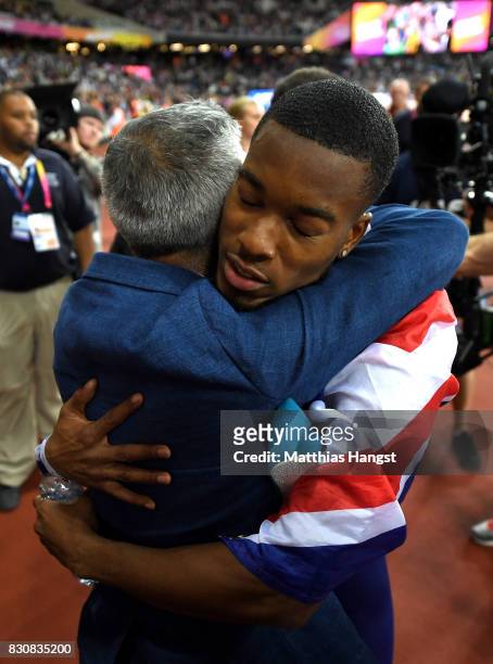 Nethaneel Mitchell-Blake of Great Britain celebrates with the Mayor of London Sadiq Khan after winning gold in the Men's 4x100 Relay final during day...