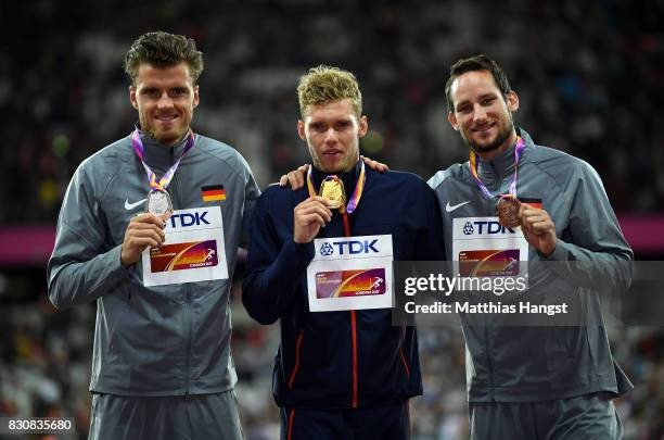 Rico Freimuth of Germany, silver, Kevin Mayer of France, gold, and Kai Kazmirek of Germany, bronze, pose with their medals for the Men's Decathlon...